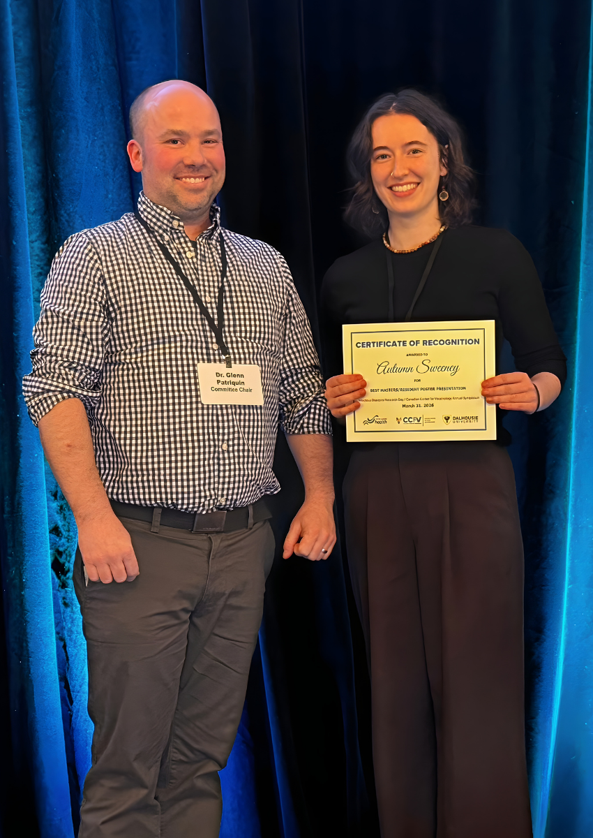  Dr. Glenn Patriquin, smiling and wearing a checkered shirt, stands next to Autumn Sweeney, smiling and wearing all black. Autumn is holding the certificate for Best Poster Presentation - Resident or Masters